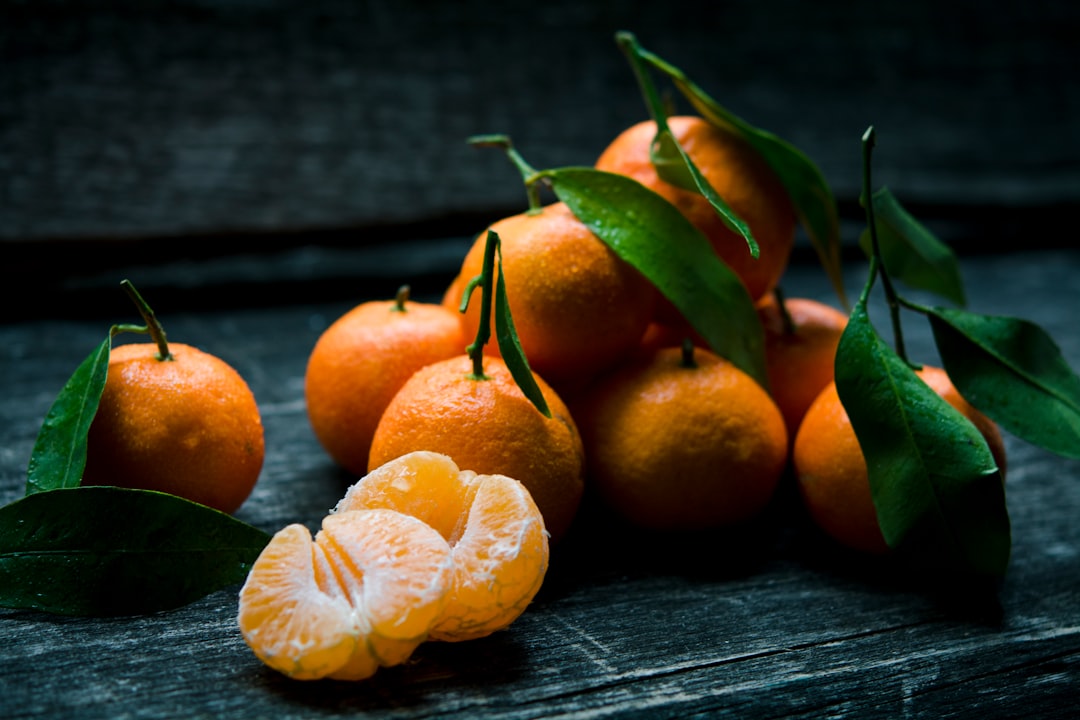 Oranges on top of gray wooden table