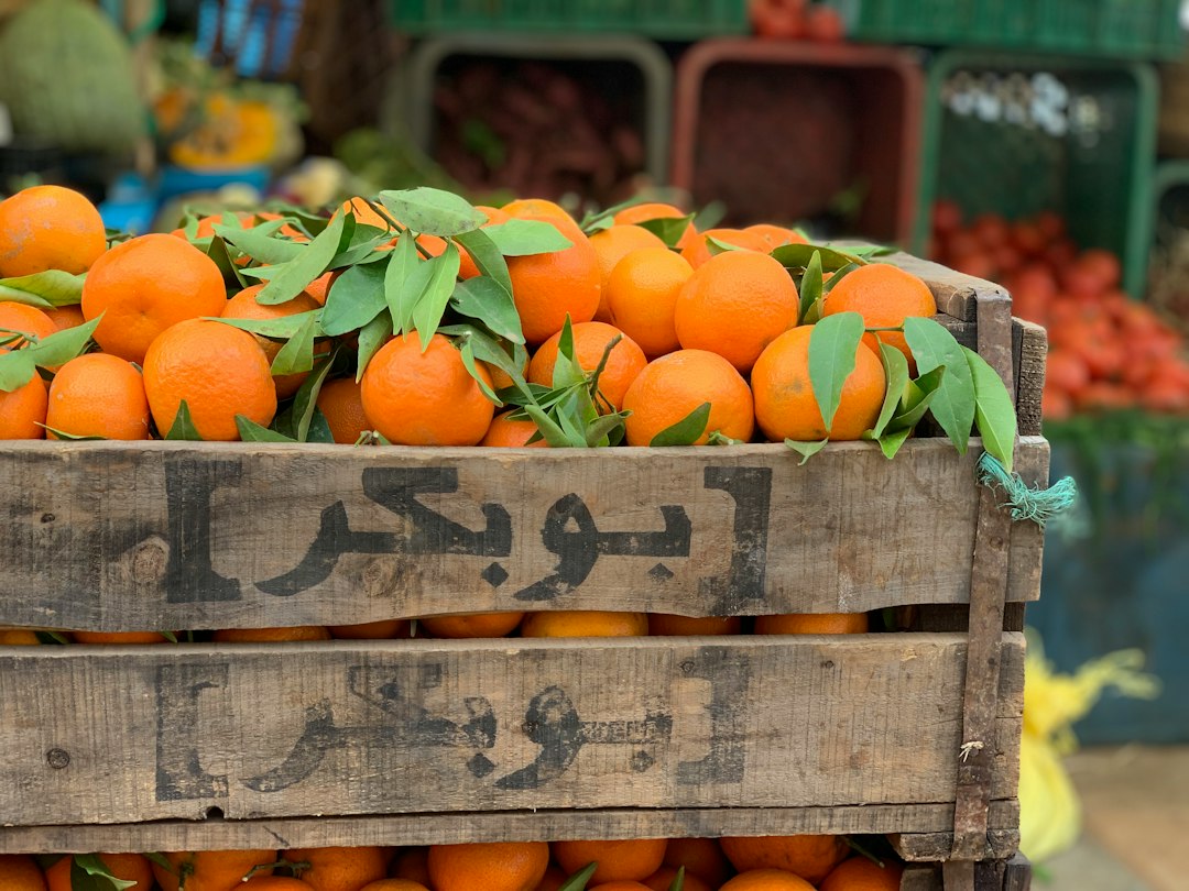 Wooden crate filled with orange fruits