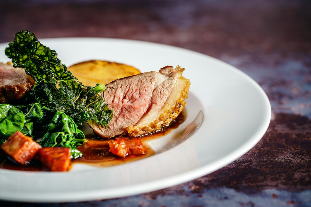 Cooked meat on white ceramic plate