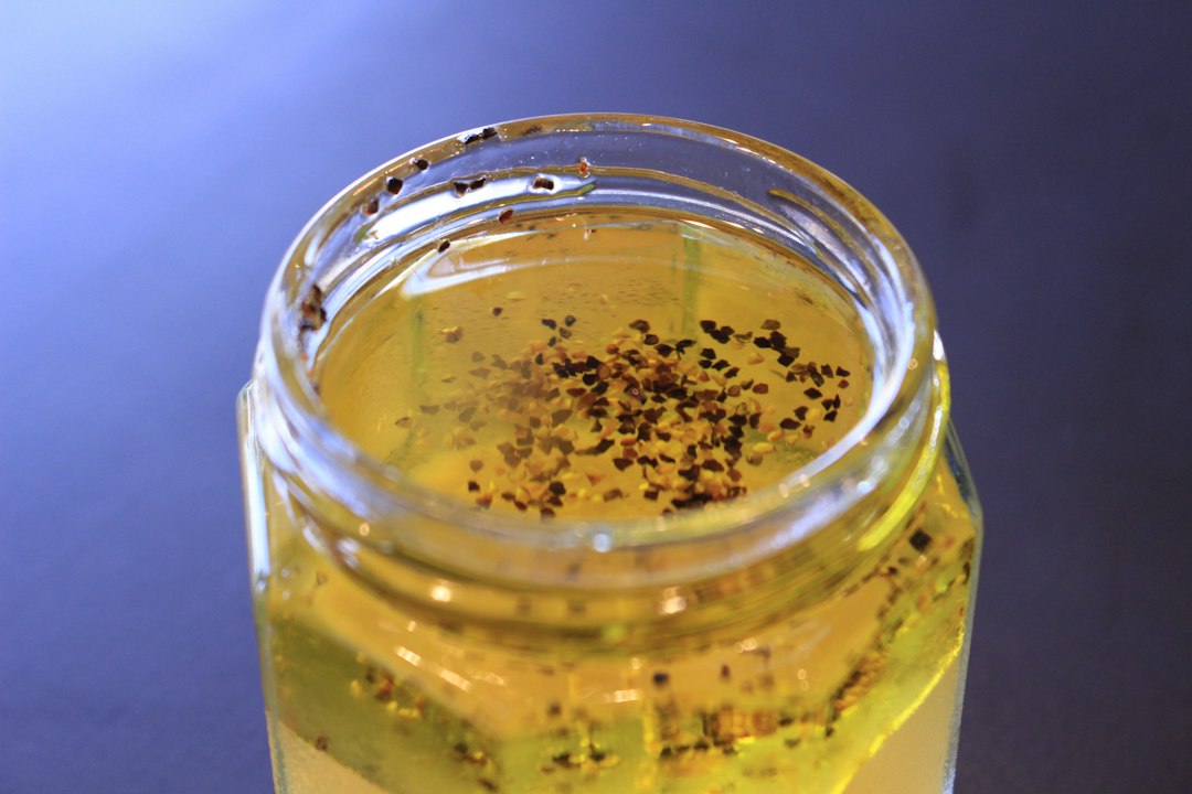 Clear glass mug with brown liquid