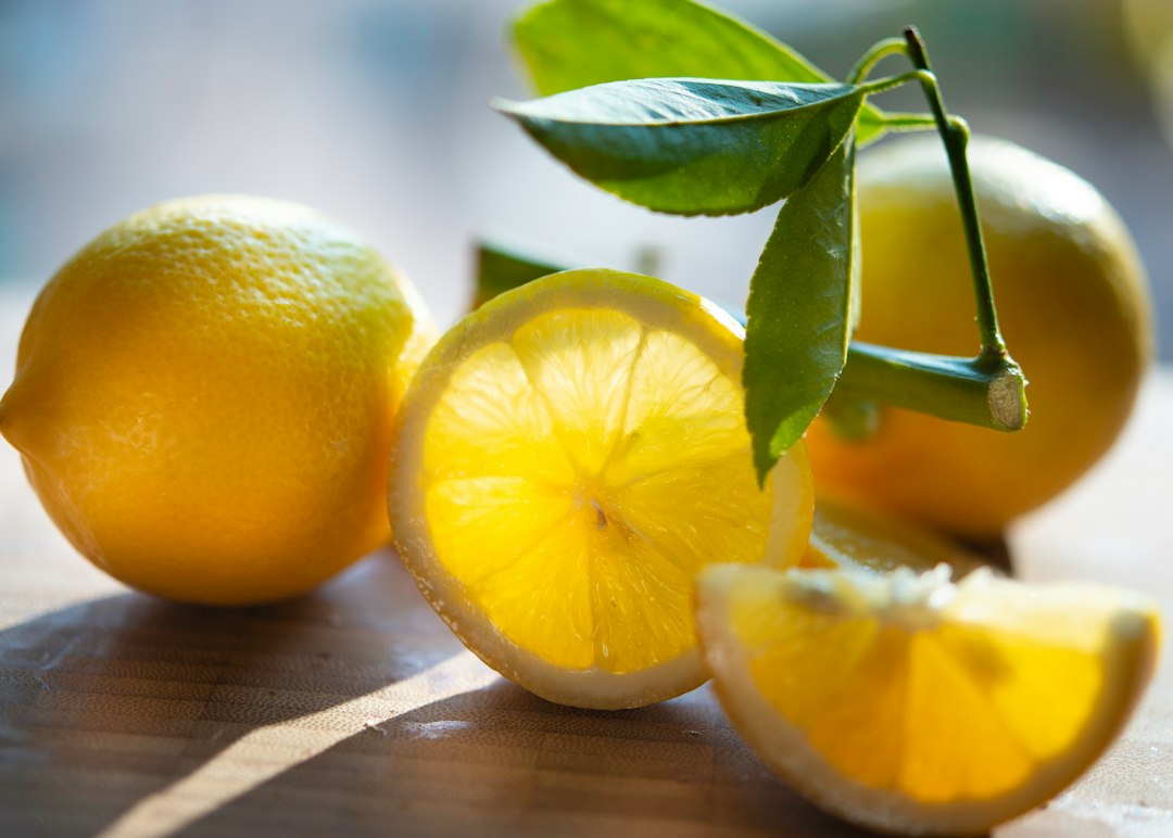 Yellow lemon fruit on brown wooden table