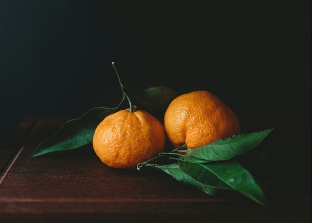 Orange fruit on brown wooden table