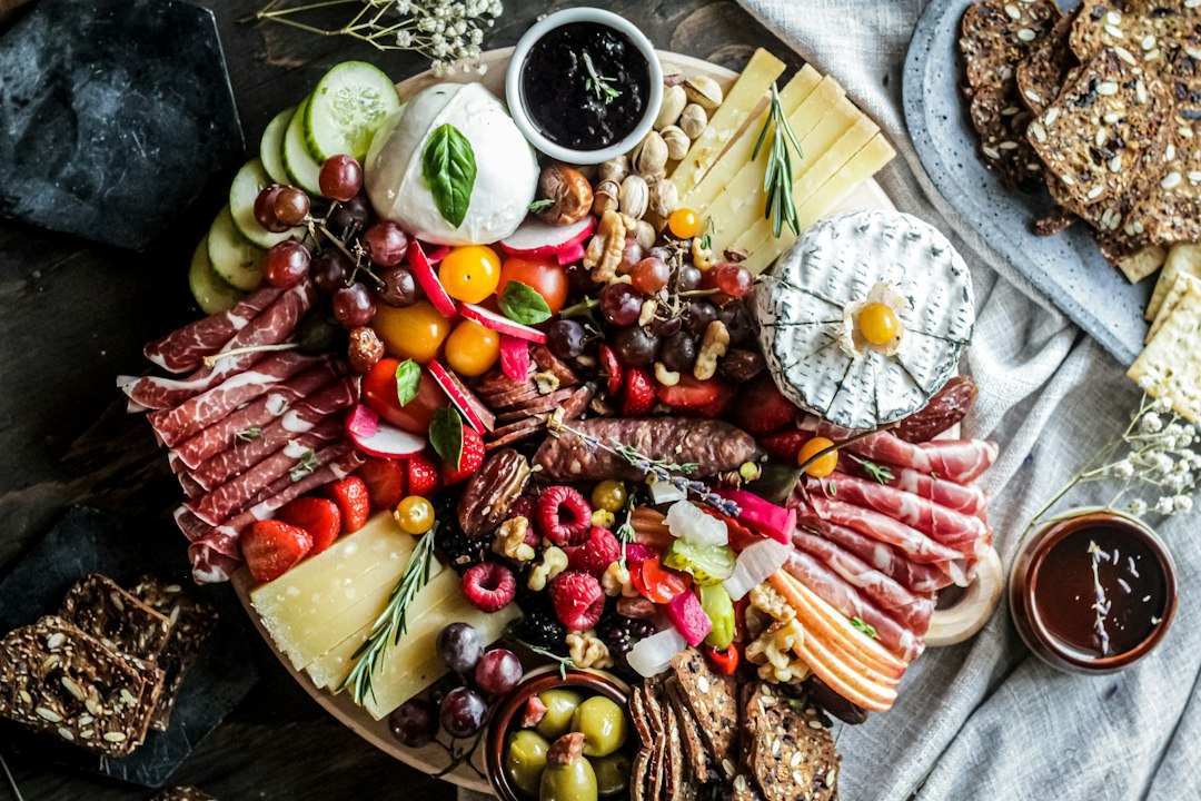 Sliced fruits on brown wooden bowl