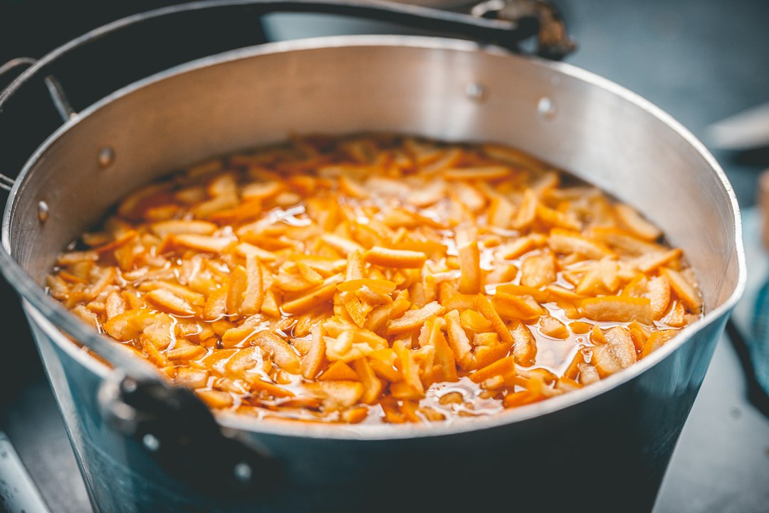 A pot filled with food sitting on top of a stove