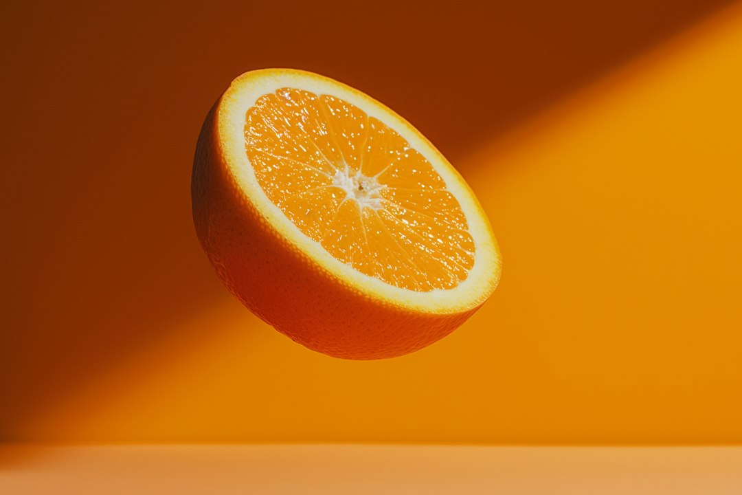 A half of an orange sitting on top of a table