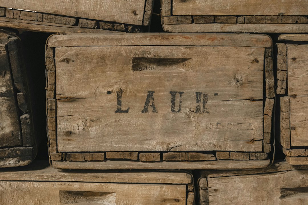 Stack of old wooden crates with "laur" visible