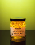 Eureka Lemon Marmalade – 11 oz small-batch California citrus preserve – backlit Eureka lemon marmalade jar against a green background – Old California Botanicals