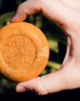 Gill Orange Soap – Gill Orange Soap held in one hand – Old California Botanicals